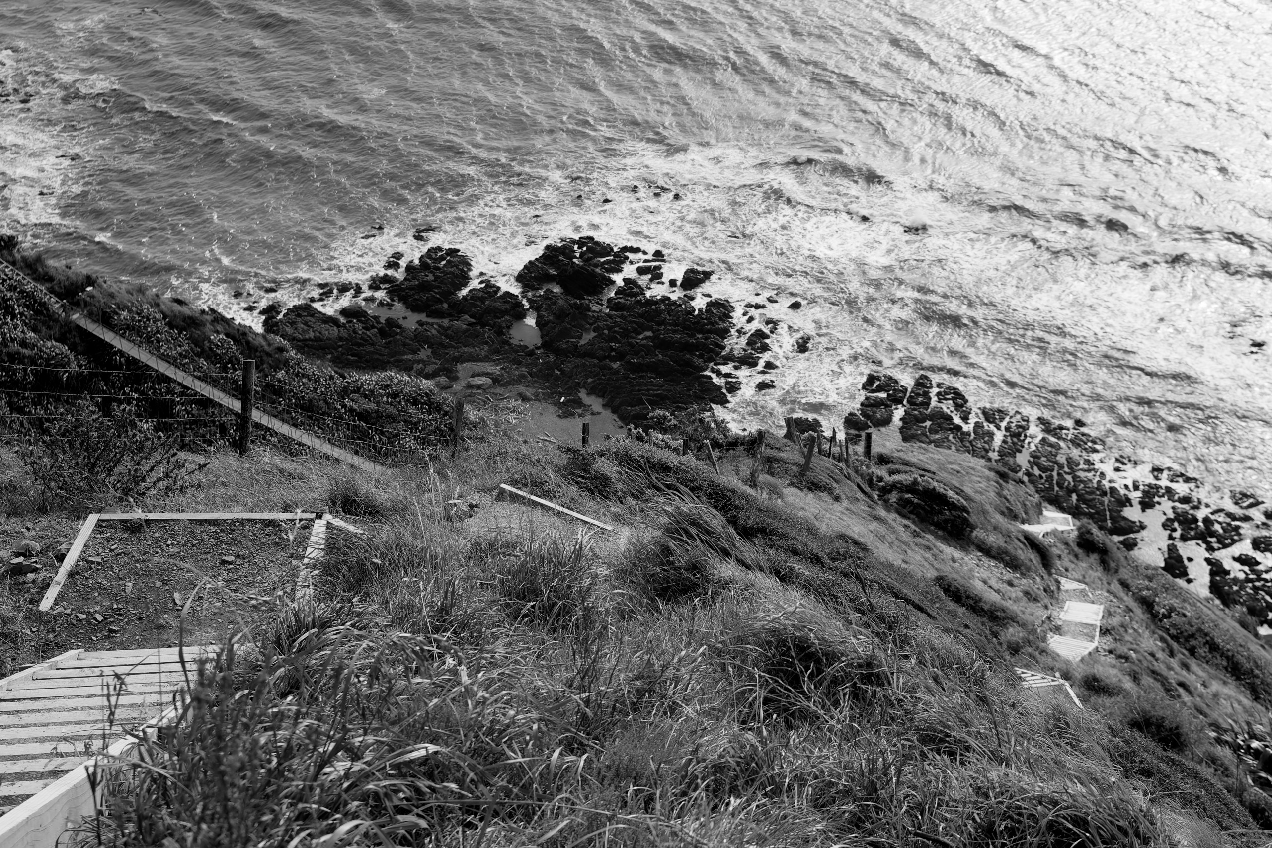 On the escarpment track between Pukerua Bay and Paekakariki. I like the leading line of the stairway towards the ocean/rocks. © 2024. This work is openly licensed via CC BY-NC 4.0