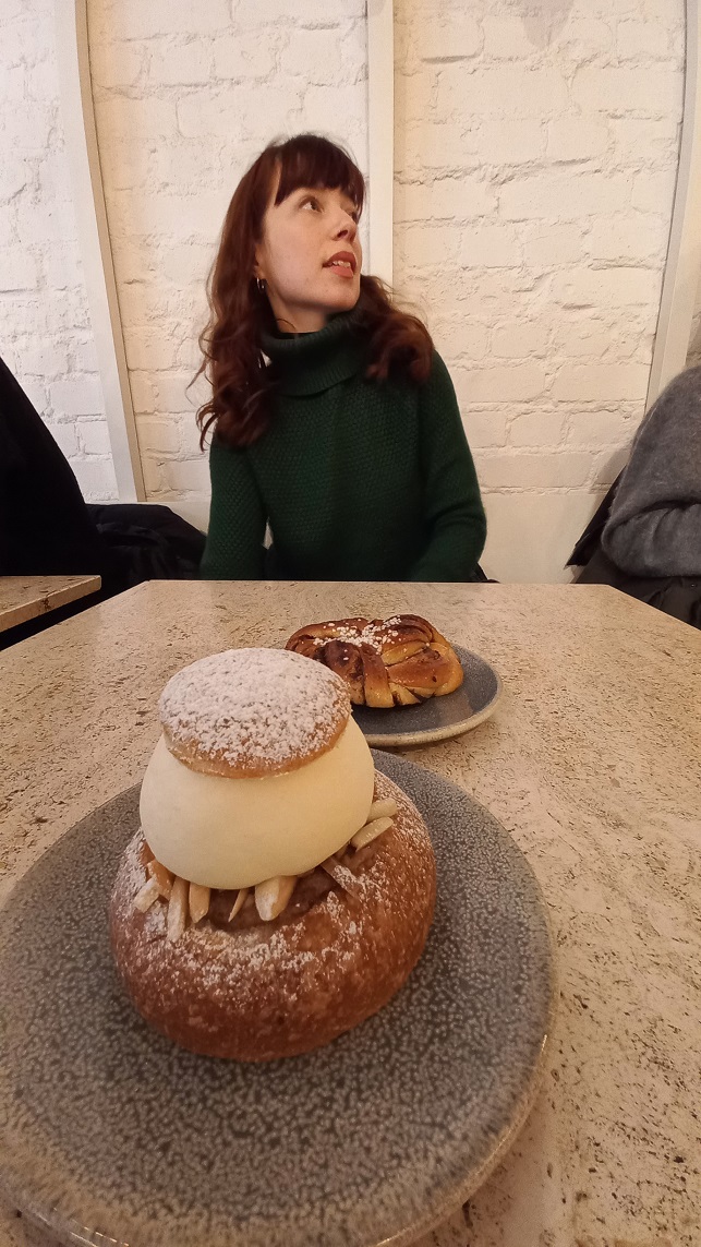 Semla – the Swedish equivalent of the fastelavnsbolle we covered last month. Filled with cream, almonds, and almond paste. (You can also spot a humble kanelbulle – cinnamon bun – in the background). © 2024. This work is openly licensed via CC BY-NC 4.0