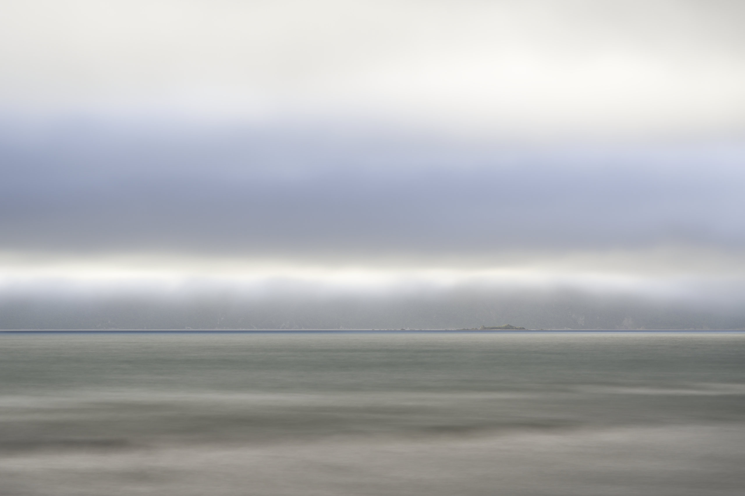Tokomapuna (Aeroplane Island) – a small body off the coast of Kapiti Island (in the background). © 2026. This work is openly licensed via CC BY-NC 4.0